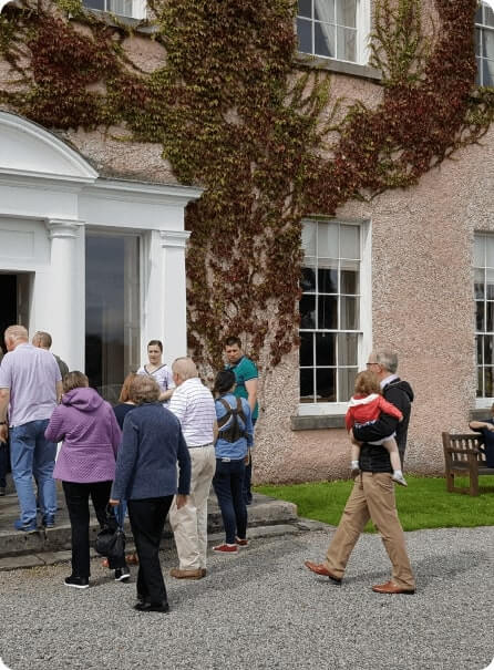 Group of people entering Enniscoe House for a training event